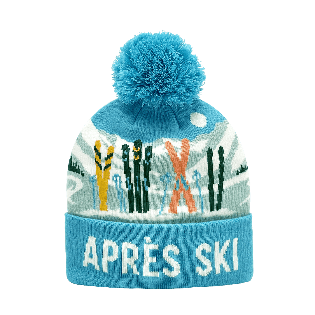 Après Ski Knit Beanie Hat with Pom Pom and Winter Ski Gear Scene
