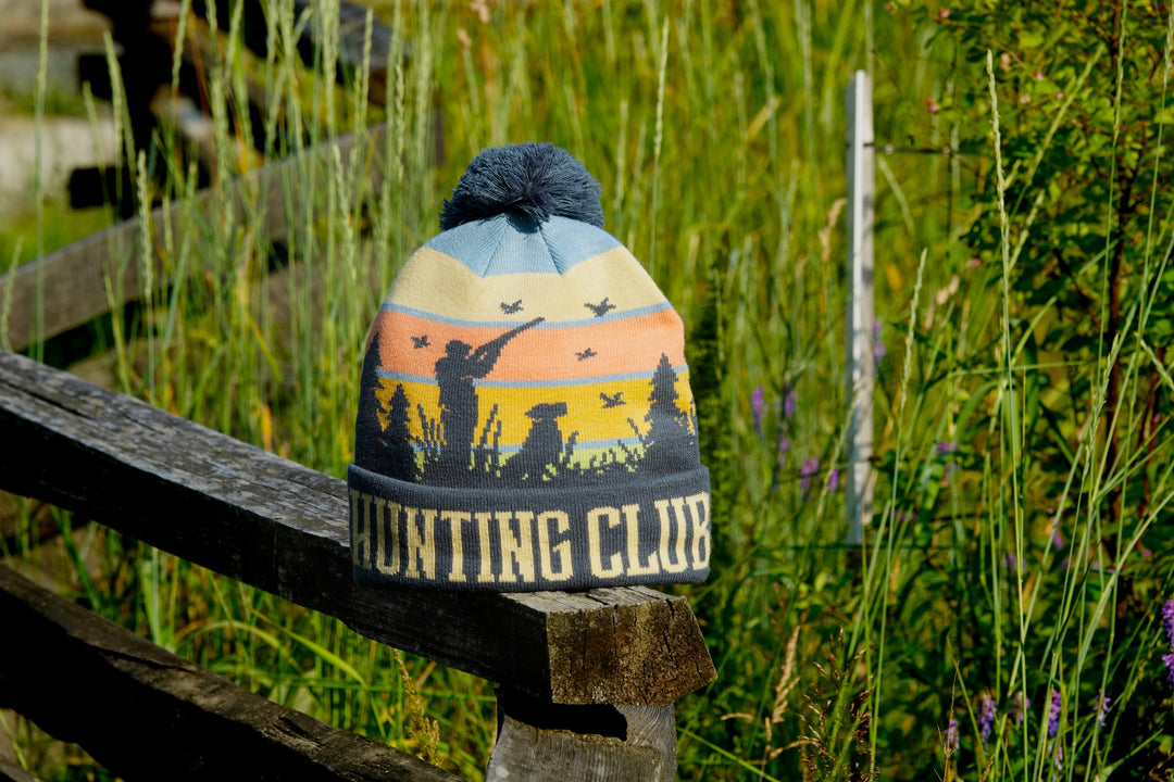 Hunting Club Knit Beanie Hat with Pom | Winter Outdoor Duck Hunting Dog Sunset Cap