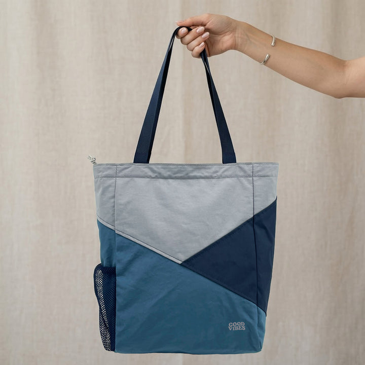 A lightweight tote designed for everyday use, blending outdoor inspiration with clean, modern functionality.