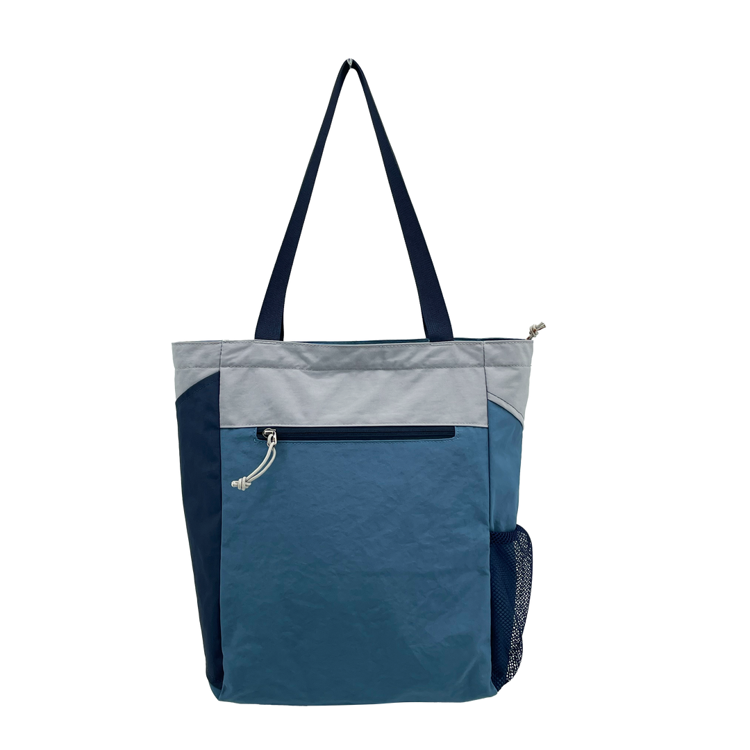 A lightweight tote designed for everyday use, blending outdoor inspiration with clean, modern functionality.